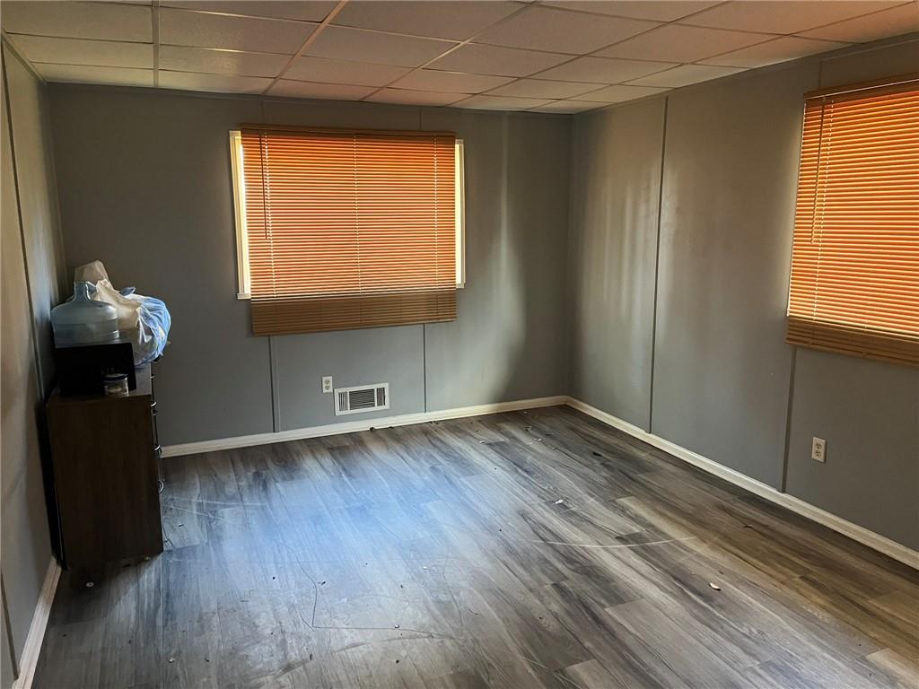 3836 Rex Circle Rex, GA 30273 - Photo 14 of 17 a view of empty room with wooden floor and fan