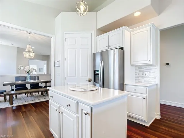 a kitchen with a sink stove and refrigerator