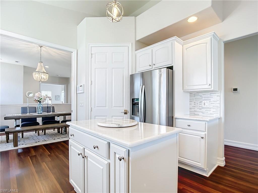 4752 Stratford Court, Unit 1404 Naples, FL 34105 - Photo 12 of 34 a kitchen with a sink stove and refrigerator