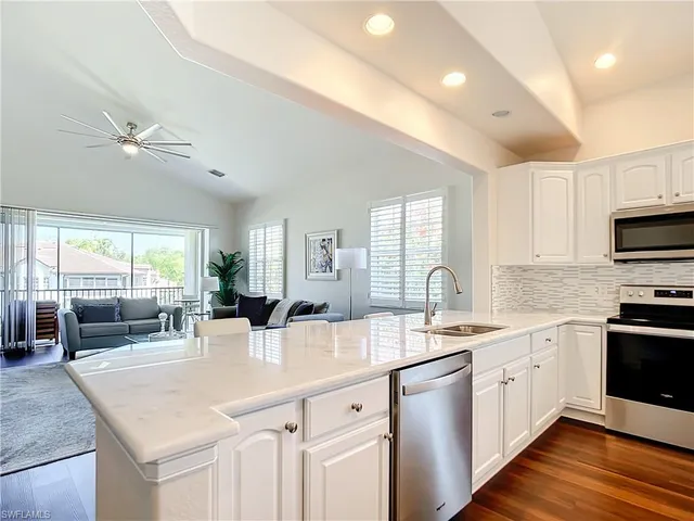 a kitchen with counter top space and appliances