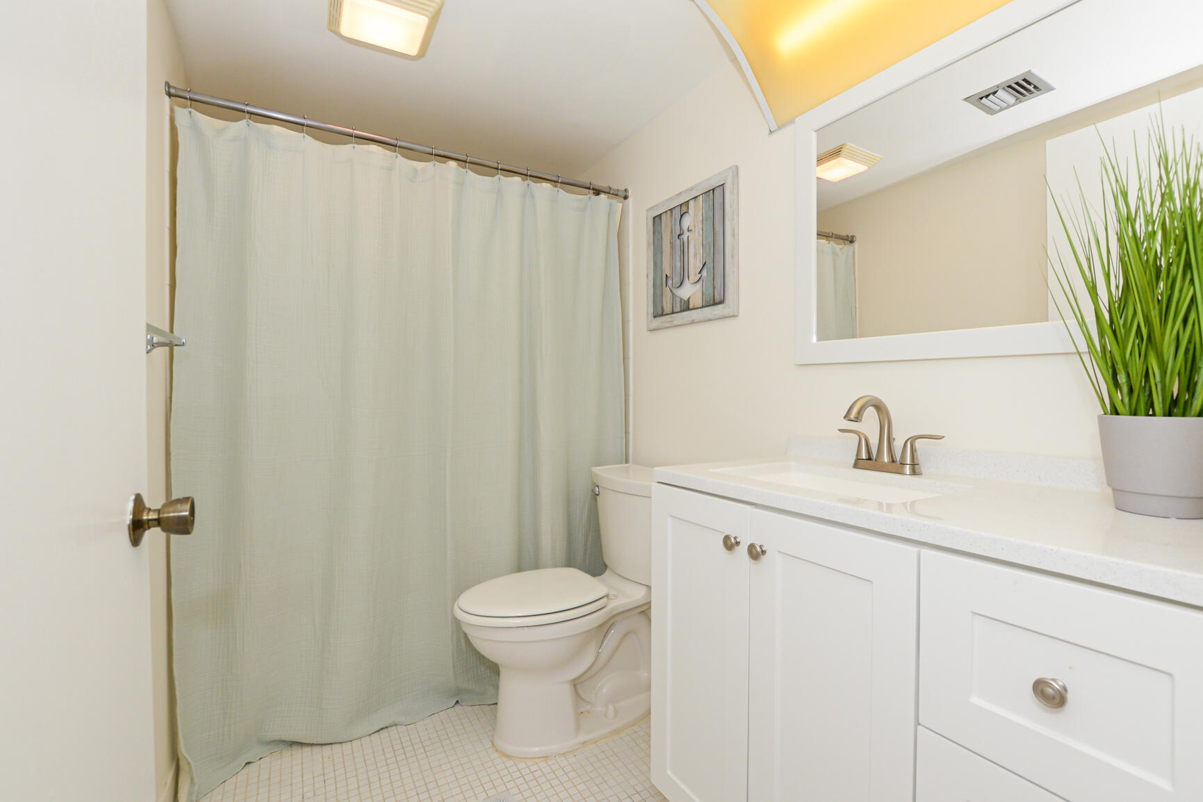 1950 Southwest Palm City Road, Unit 12103 Stuart, FL 34994 - Photo 14 of 37 a bathroom with a sink a toilet and shower