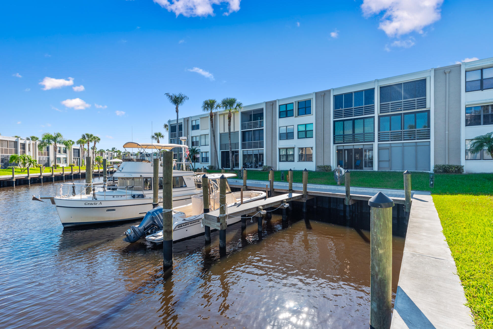 1950 Southwest Palm City Road, Unit 12103 Stuart, FL 34994 - Photo 4 of 37 a swimming pool view with a outdoor seating