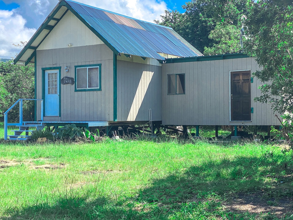 94-1488 Kala Place Naalehu, HI 96772 - Photo 2 of 19 a view of house with backyard