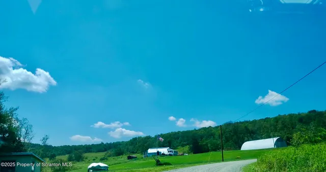 a view of a house with a big yard