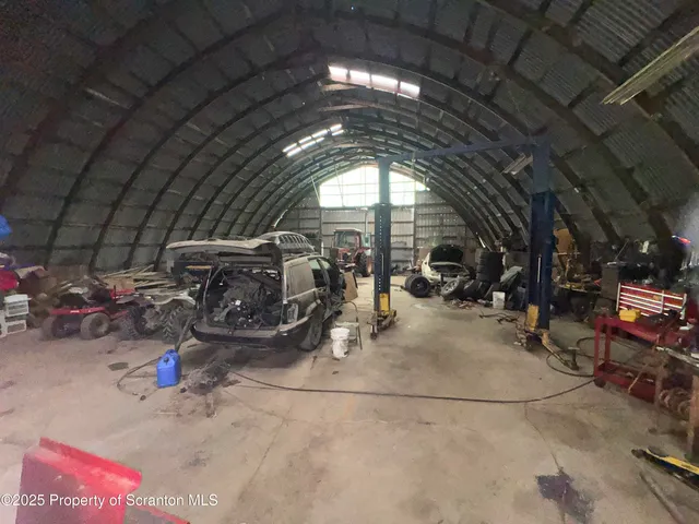 a view of parking garage with cars