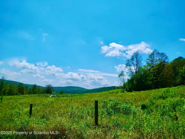 a view of a building with a big yard