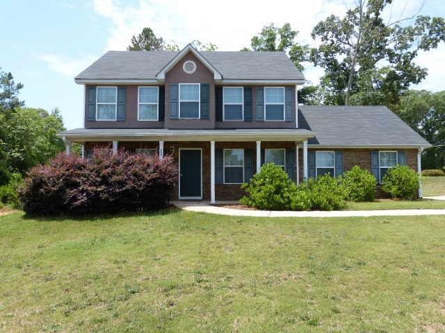 10 Patterson Way Covington, GA 30016 - Photo 1 of 1 a front view of a house with garden