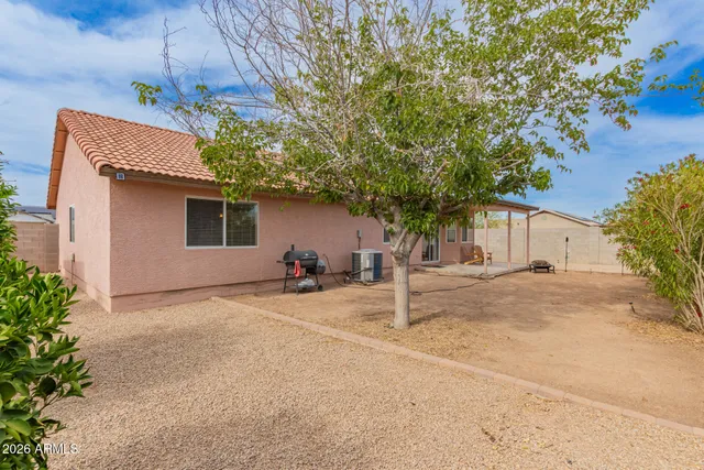 a view of a house with a yard and garage