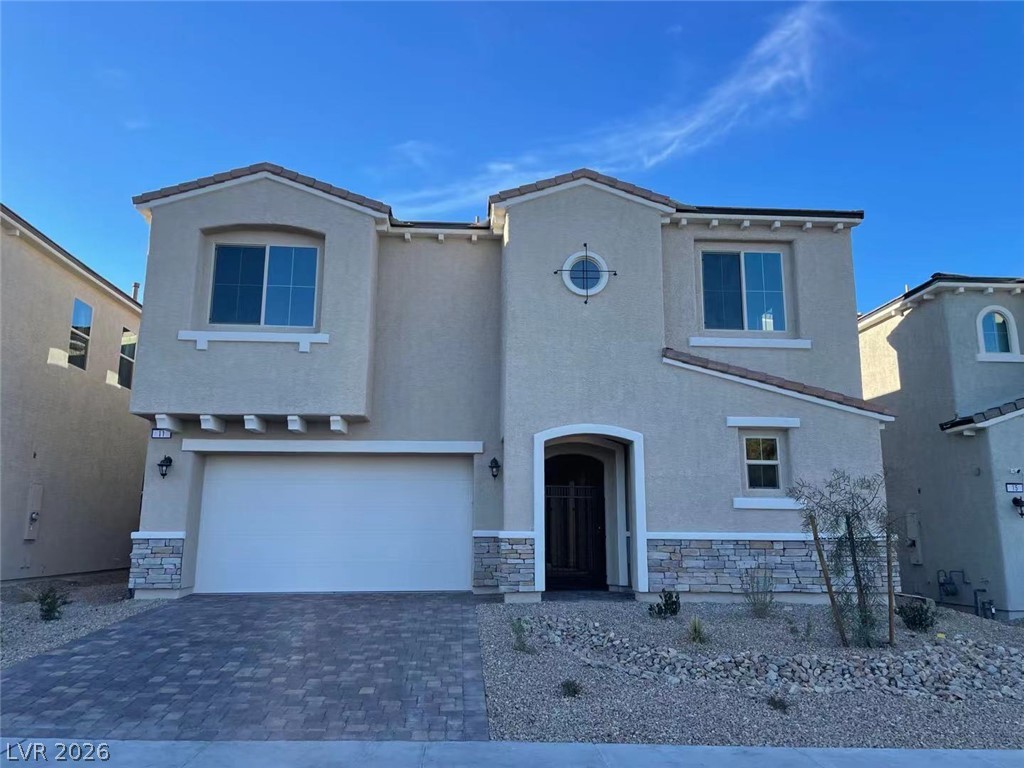 11 Rancho Maria Street Las Vegas, NV 89148 - Photo 1 of 27 Clean architectural lines and modern masonry accents define this contemporary two-story exterior facade.
