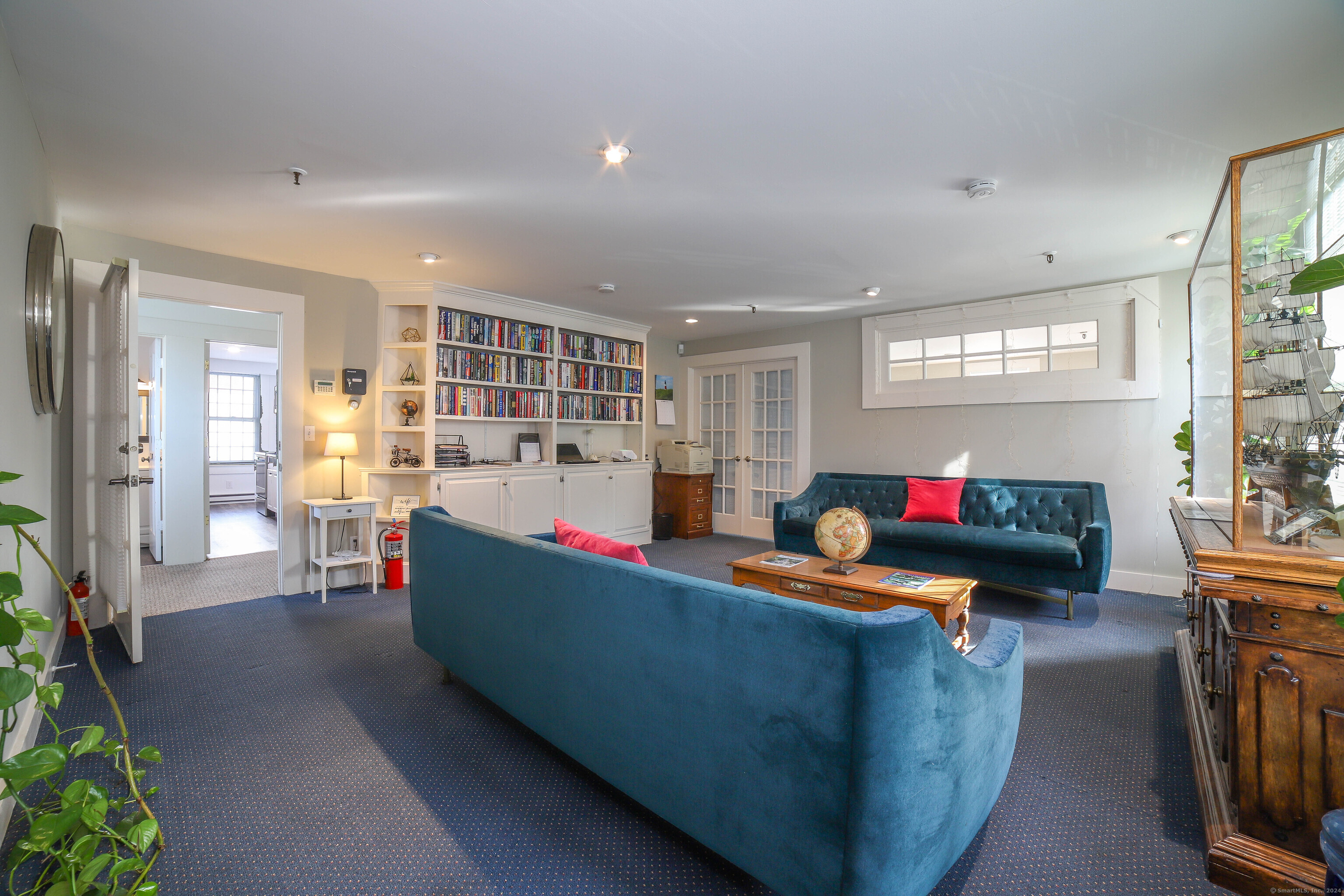 125 Main Street Old Saybrook, CT 06475 - Photo 18 of 30 a living room with furniture and a potted plant