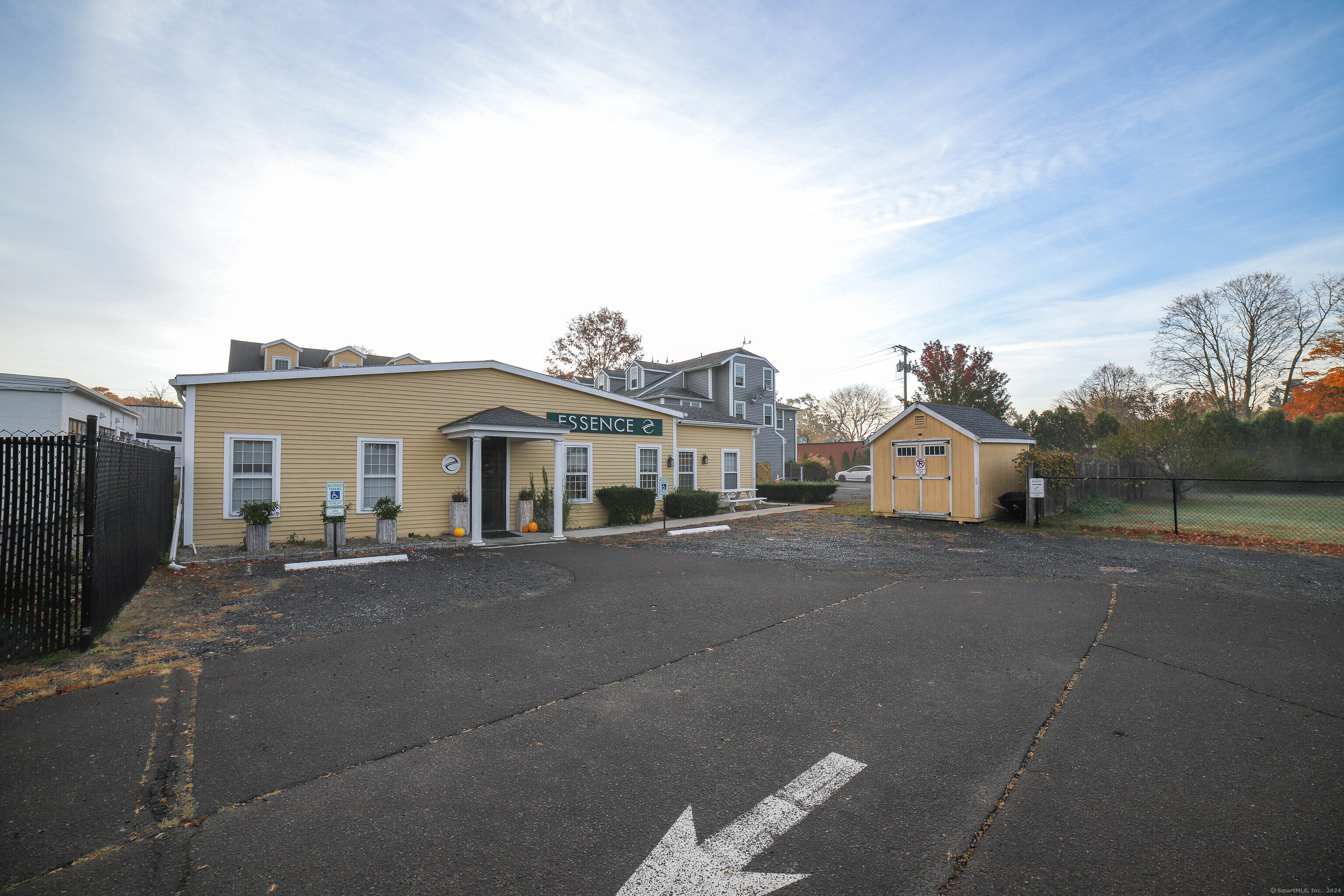 125 Main Street Old Saybrook, CT 06475 - Photo 28 of 30 a front view of a house with a yard and garage