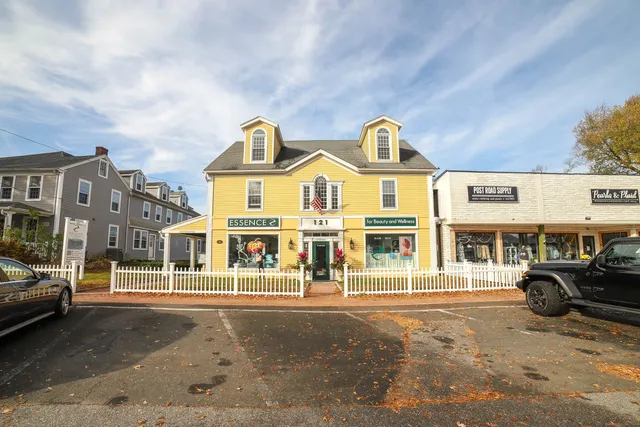 a view of building with cars parked