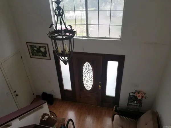 a view of entryway with wooden floor