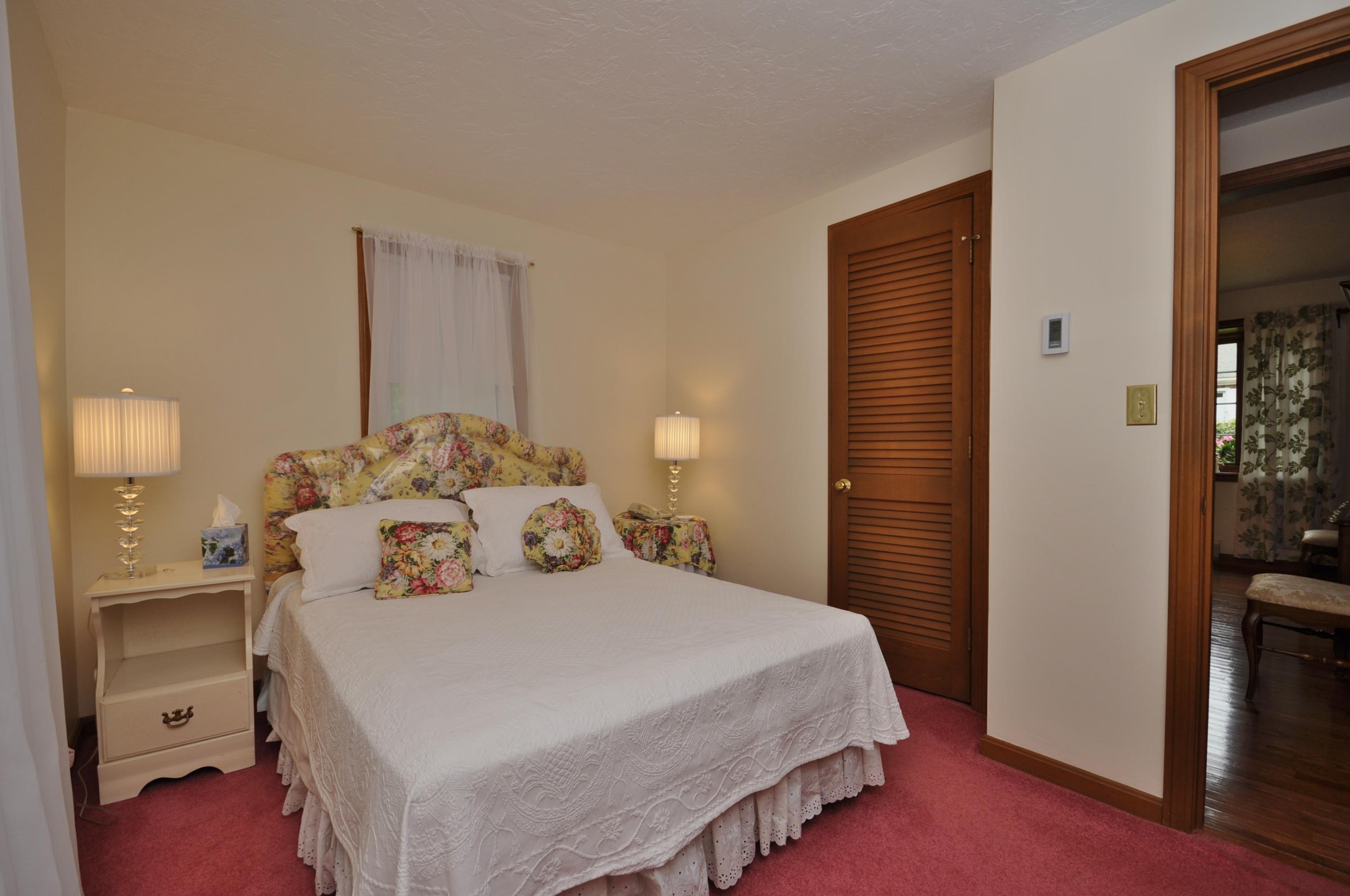 30 Longfellow Road Sagamore Beach, MA 02562 - Photo 12 of 21 a bedroom with a bed and a lamp
