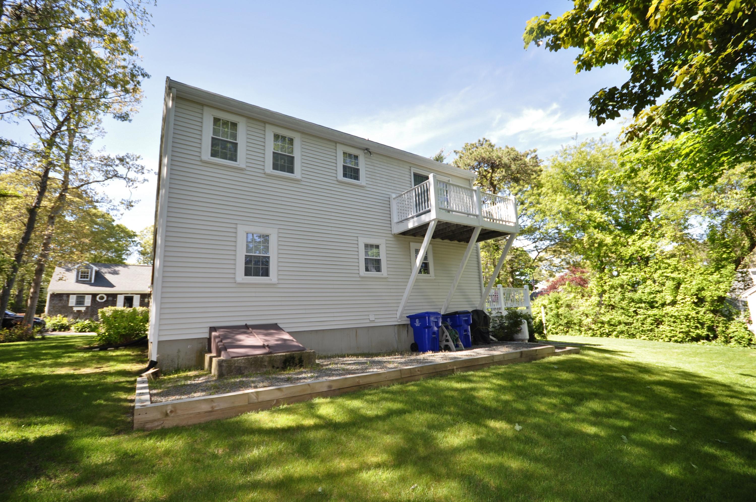 30 Longfellow Road Sagamore Beach, MA 02562 - Photo 19 of 21 a view of a backyard with a tree