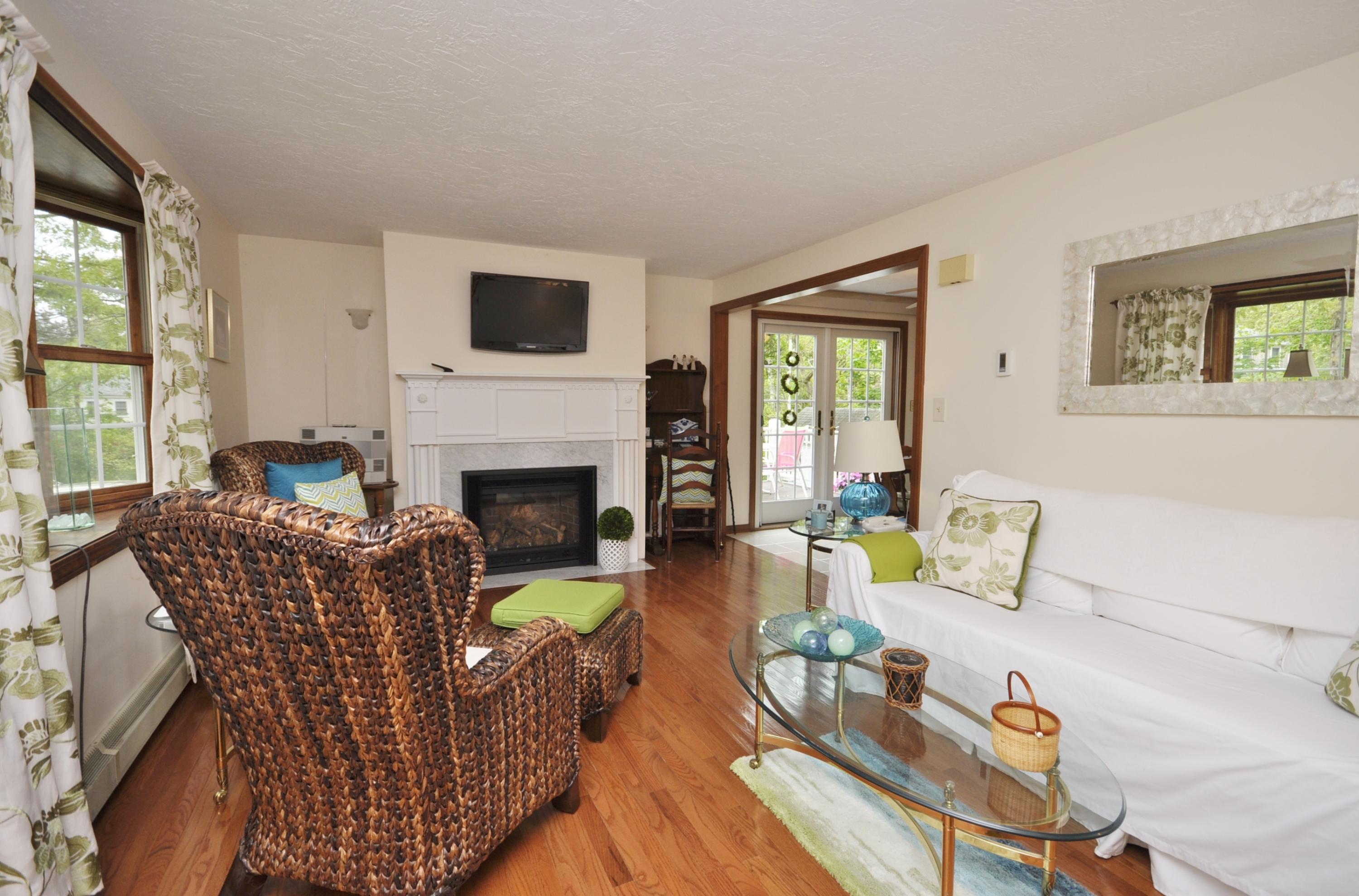 30 Longfellow Road Sagamore Beach, MA 02562 - Photo 3 of 21 a living room with furniture fireplace and a flat screen tv