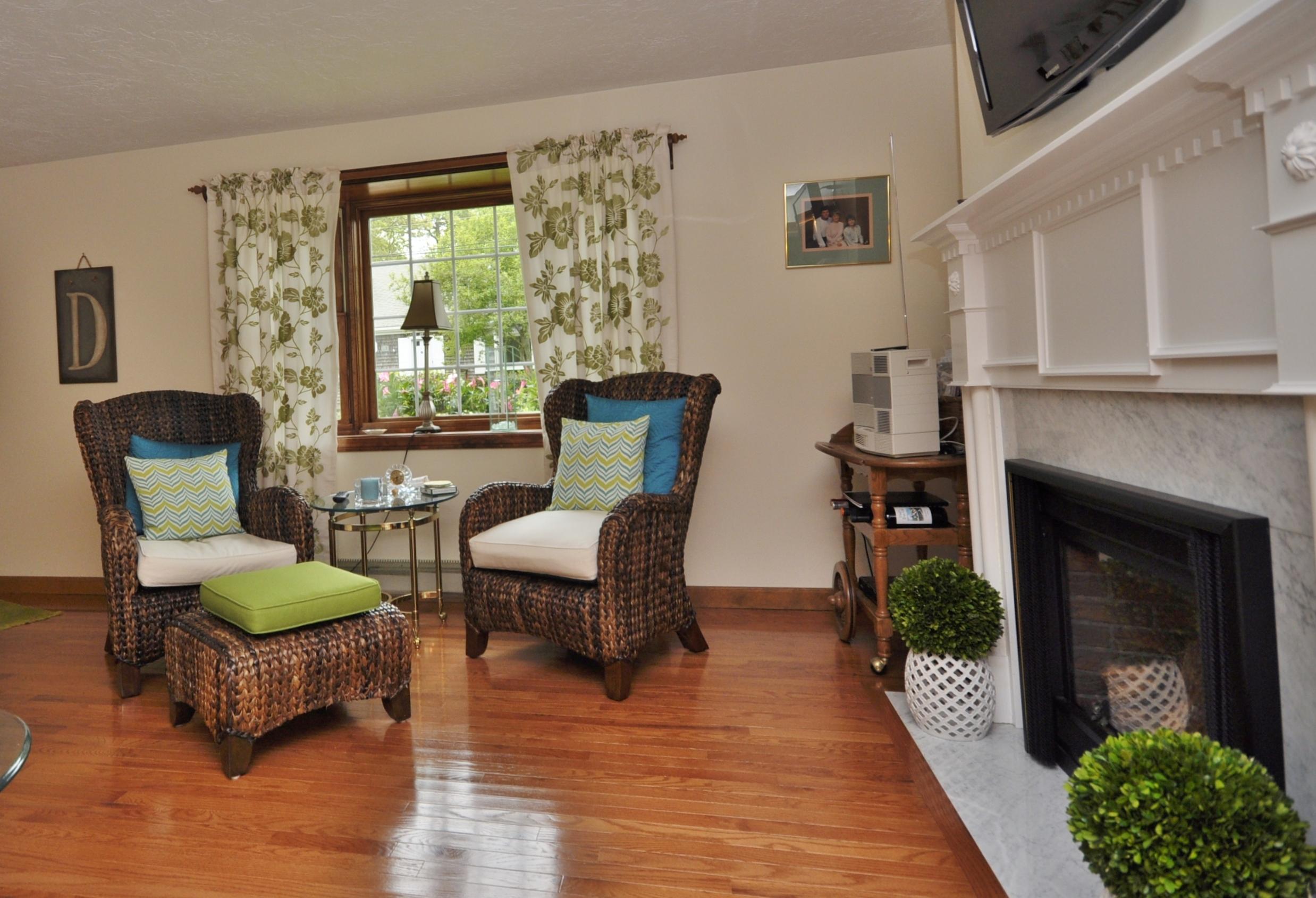 30 Longfellow Road Sagamore Beach, MA 02562 - Photo 4 of 21 a living room with furniture and a fireplace