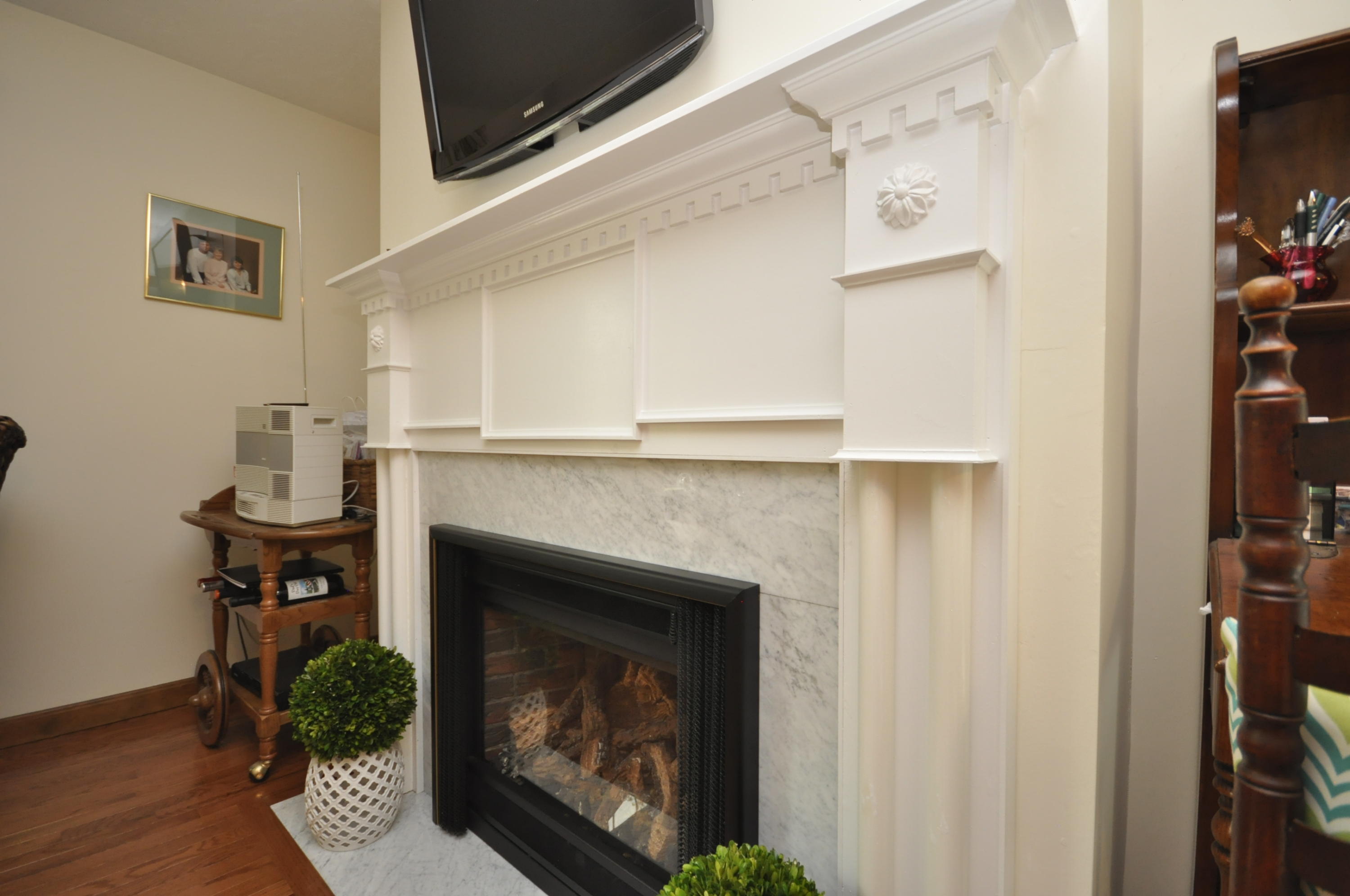 30 Longfellow Road Sagamore Beach, MA 02562 - Photo 5 of 21 a living room with furniture and a fireplace