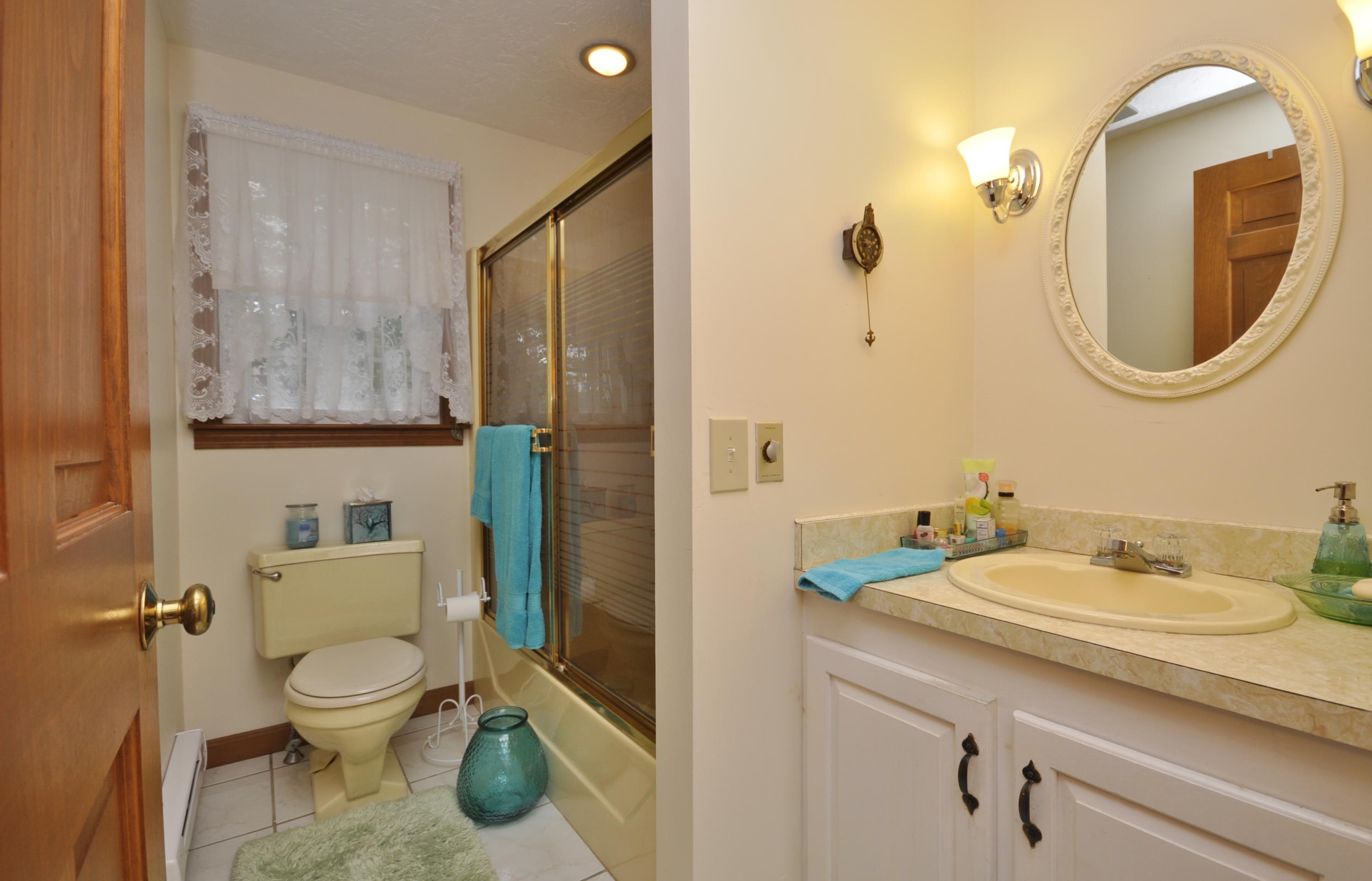 30 Longfellow Road Sagamore Beach, MA 02562 - Photo 9 of 21 a bathroom with a toilet a sink and mirror