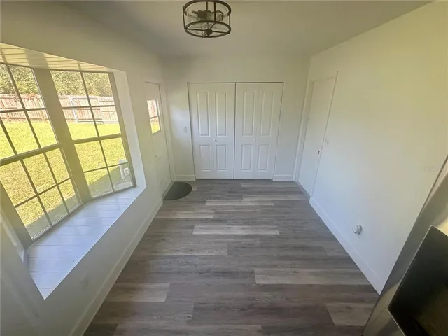 a view of livingroom and hardwood floor