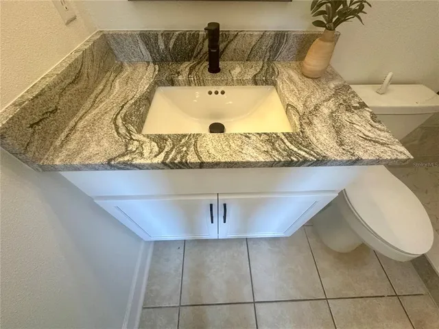 a bathroom with a sink and mirror