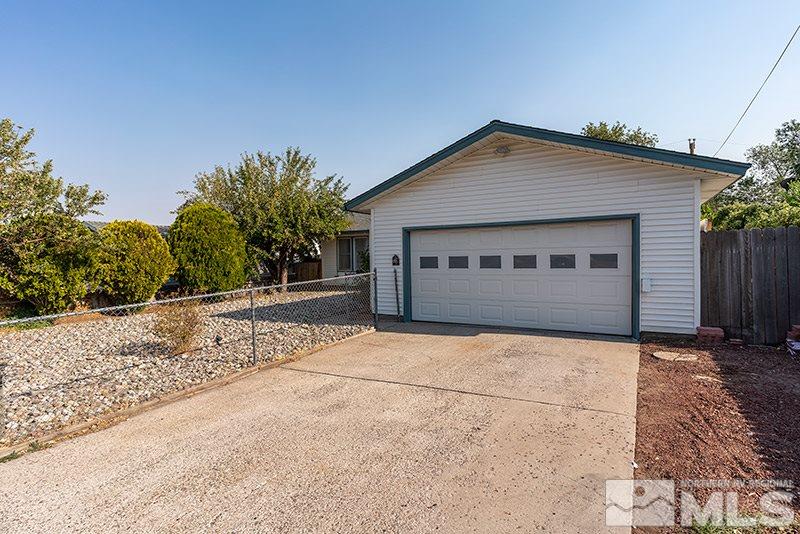 3450 Bryan Street Reno, NV 89503 - Photo 2 of 18 a front view of a house with a garage