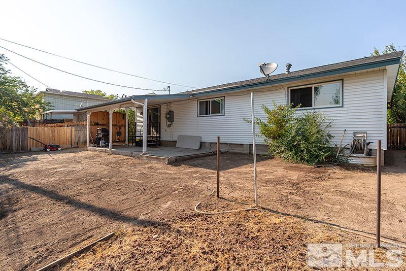 3450 Bryan Street Reno, NV 89503 - Photo 5 of 18 a backyard of a house with table and chairs