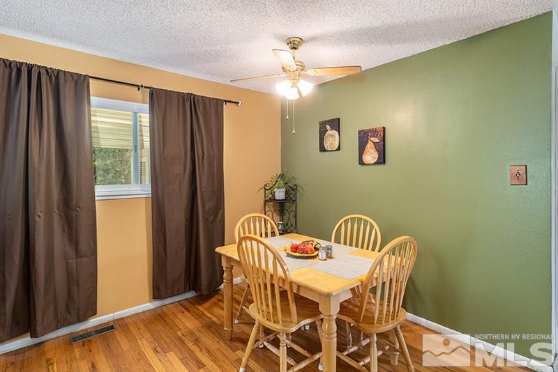 3450 Bryan Street Reno, NV 89503 - Photo 9 of 18 a view of a dining room with furniture and a window