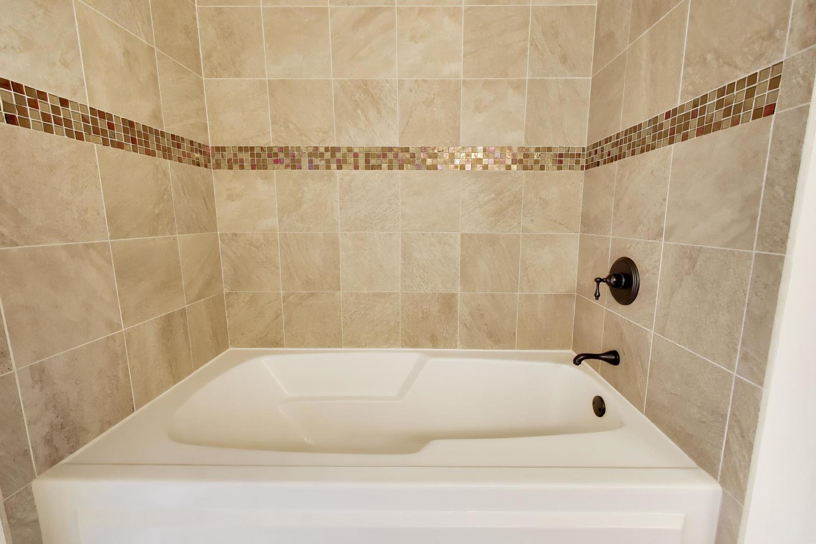 1200 West Monroe Street, Unit 502 Chicago, IL 60607 - Photo 16 of 34 a bathroom with a bathtub and a shower