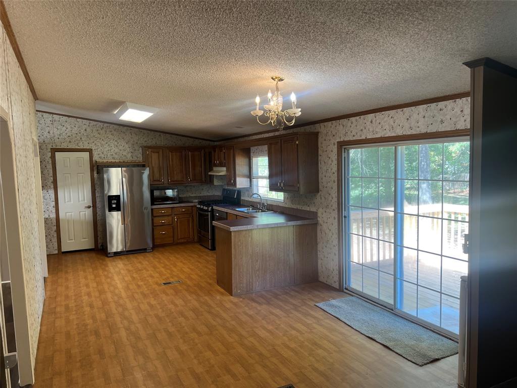 368 Fox Creek Haughton, LA 71037 - Photo 12 of 24 a view of a kitchen with a stove cabinets and a kitchen