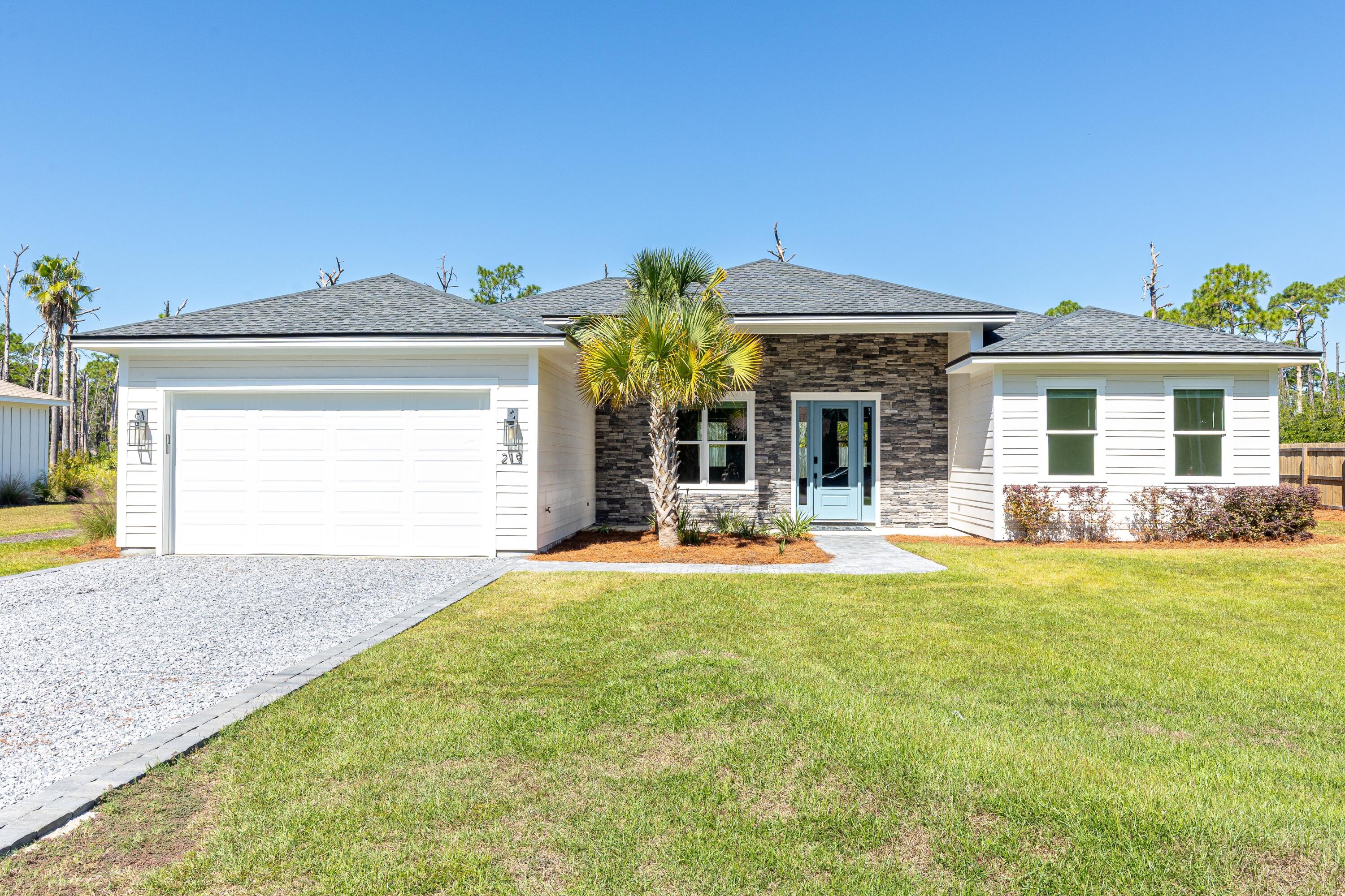 219 Loral Road Santa Rosa Beach, FL 32459 - Photo 1 of 26 a view of a house with backyard porch and patio