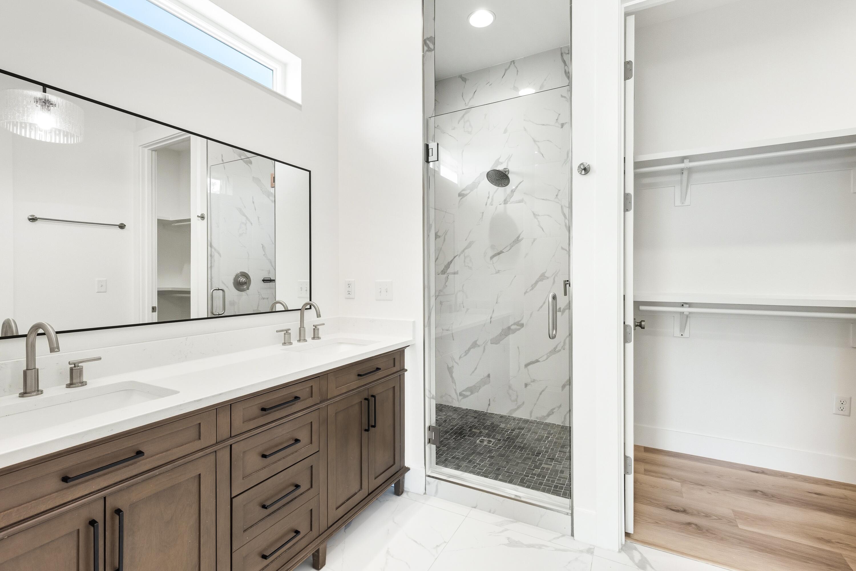 219 Loral Road Santa Rosa Beach, FL 32459 - Photo 15 of 26 a bathroom with a shower sink and mirror