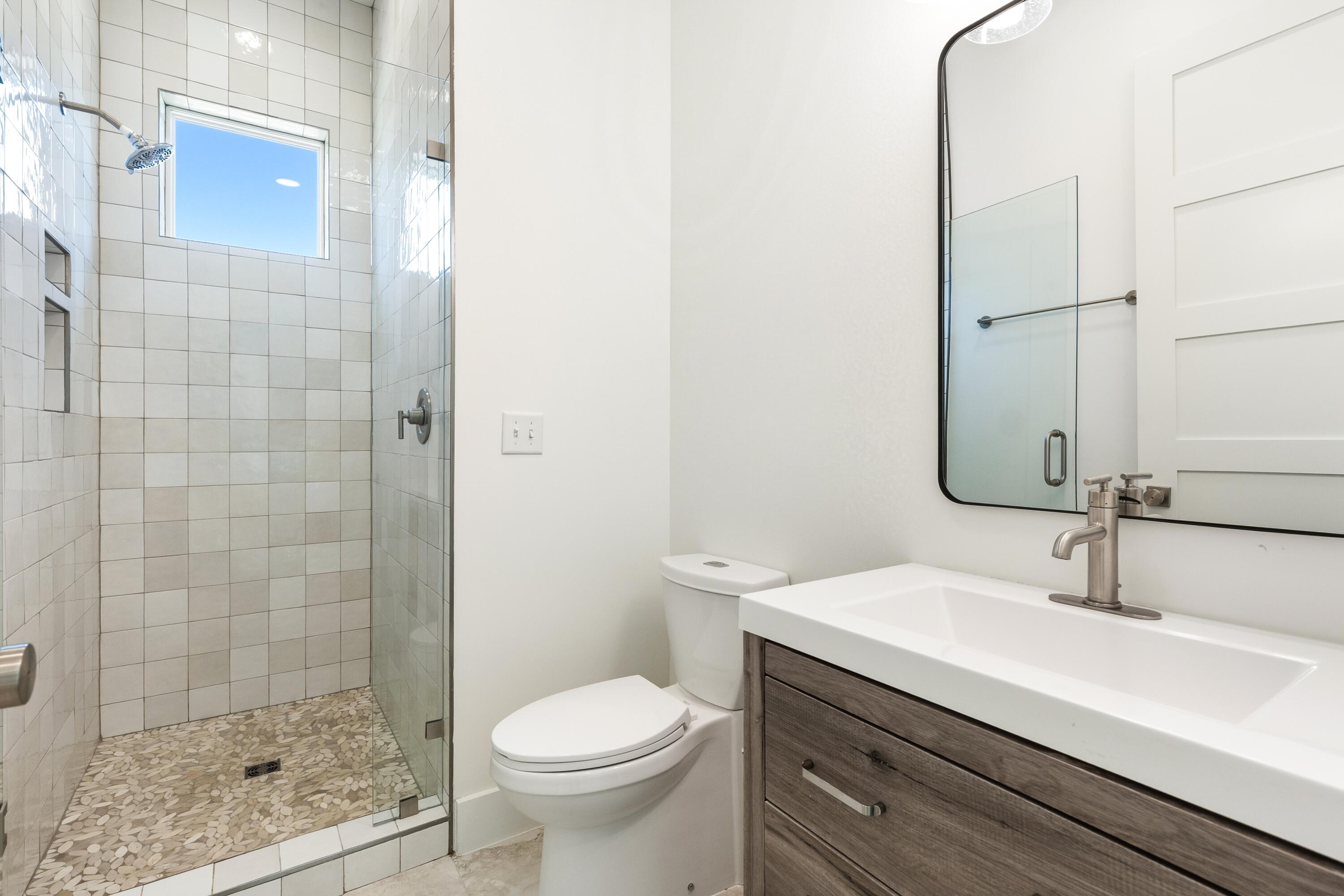 219 Loral Road Santa Rosa Beach, FL 32459 - Photo 18 of 26 a bathroom with a sink a toilet and shower