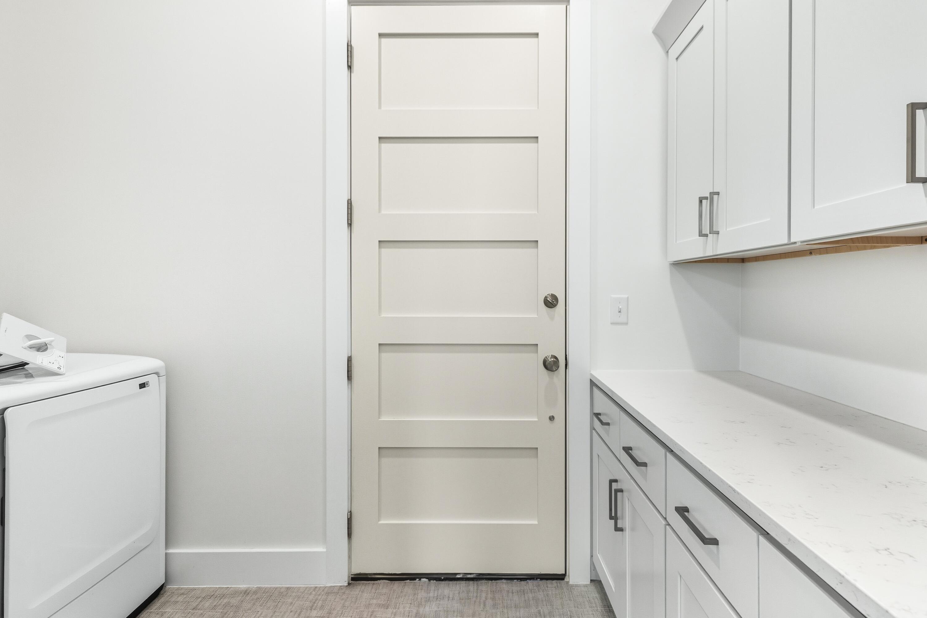 219 Loral Road Santa Rosa Beach, FL 32459 - Photo 22 of 26 a view of walk in closet with empty racks