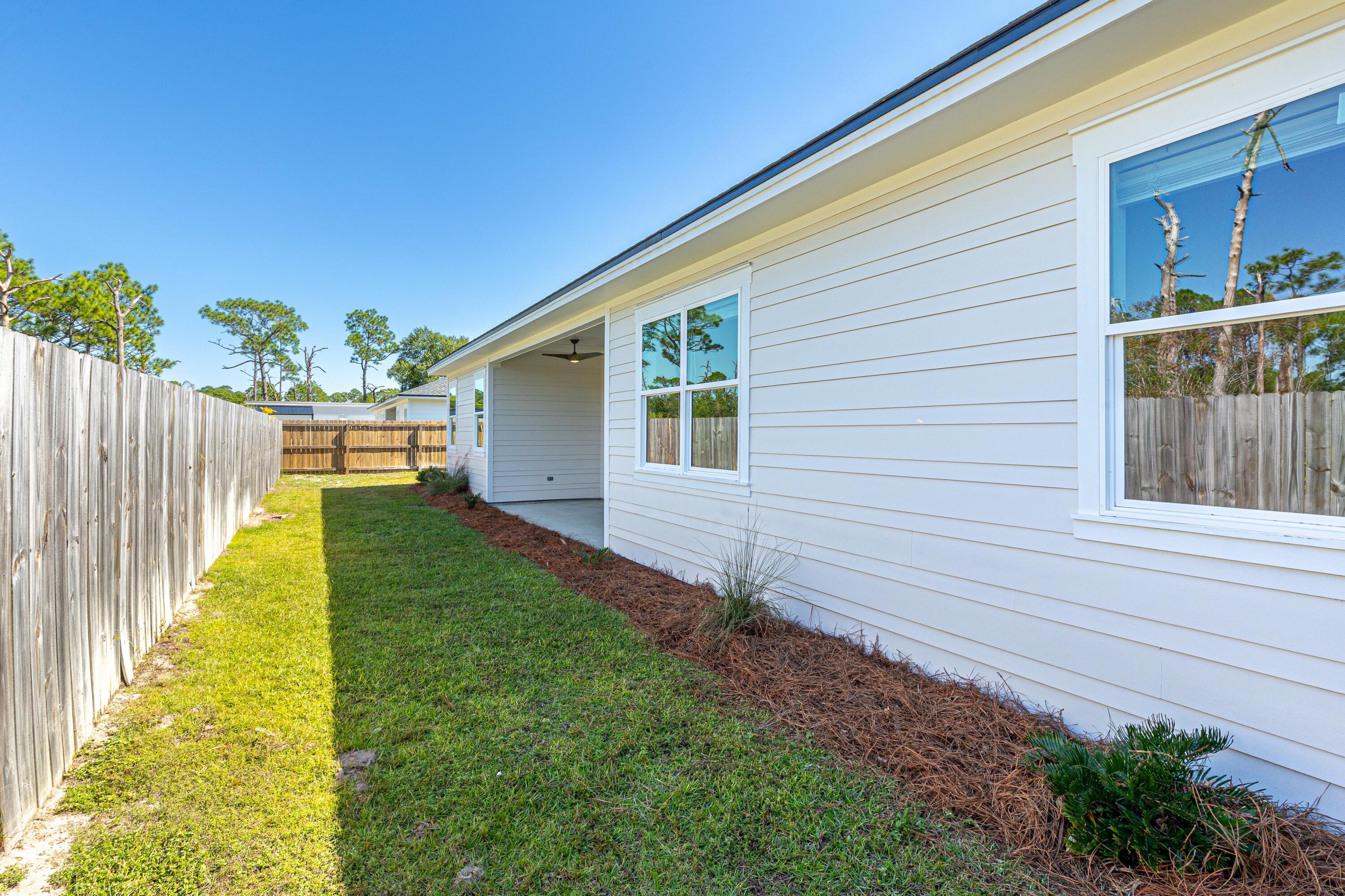 219 Loral Road Santa Rosa Beach, FL 32459 - Photo 25 of 26 a front view of house with yard