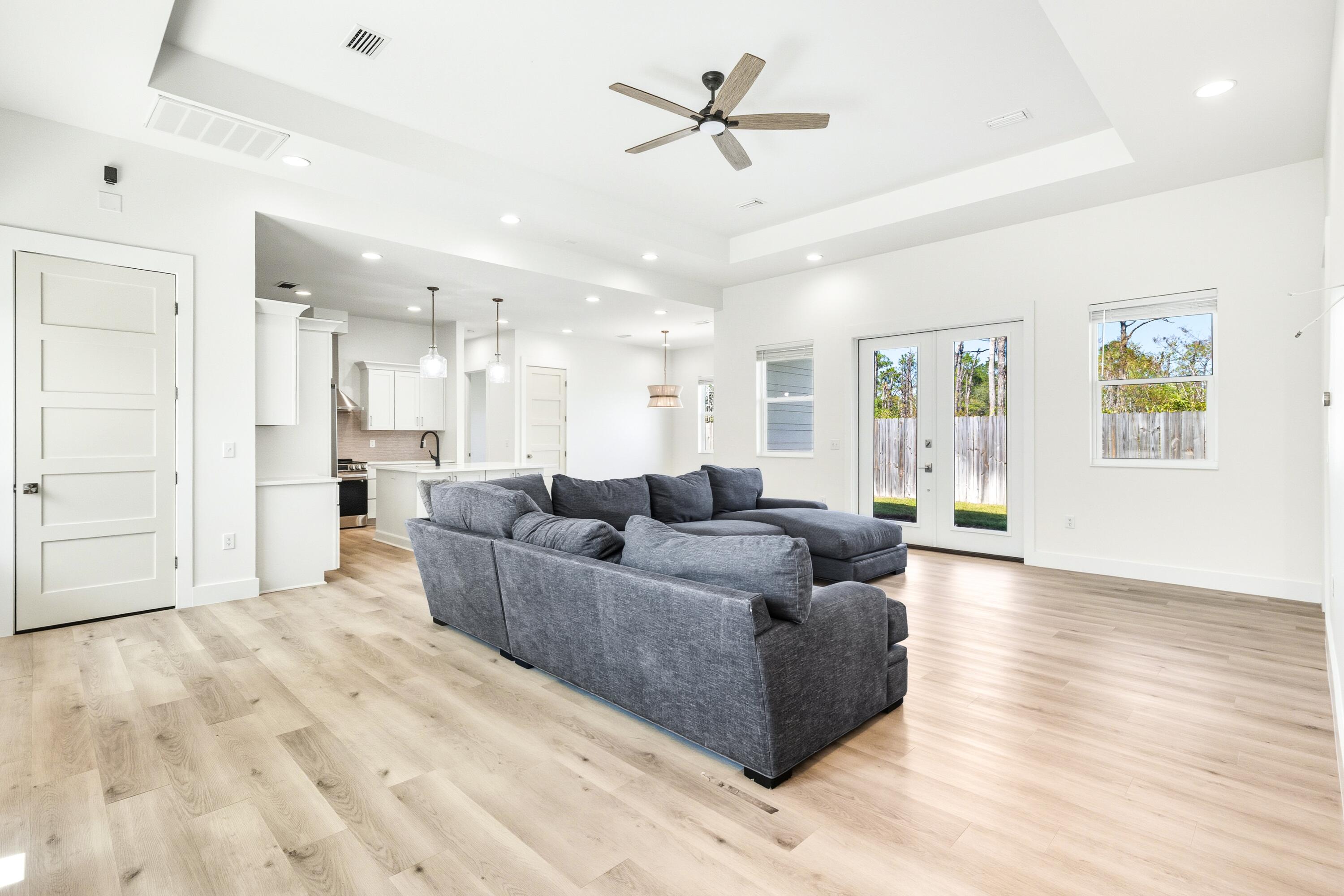 219 Loral Road Santa Rosa Beach, FL 32459 - Photo 5 of 26 a living room with furniture and a wooden floor