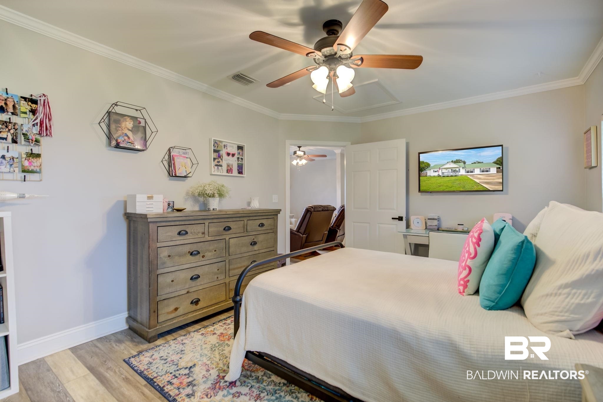 18732 Fairground Road Robertsdale, AL 36567 - Photo 29 of 46 Bedroom with light hardwood / wood-style floors, crown molding, and ceiling fan