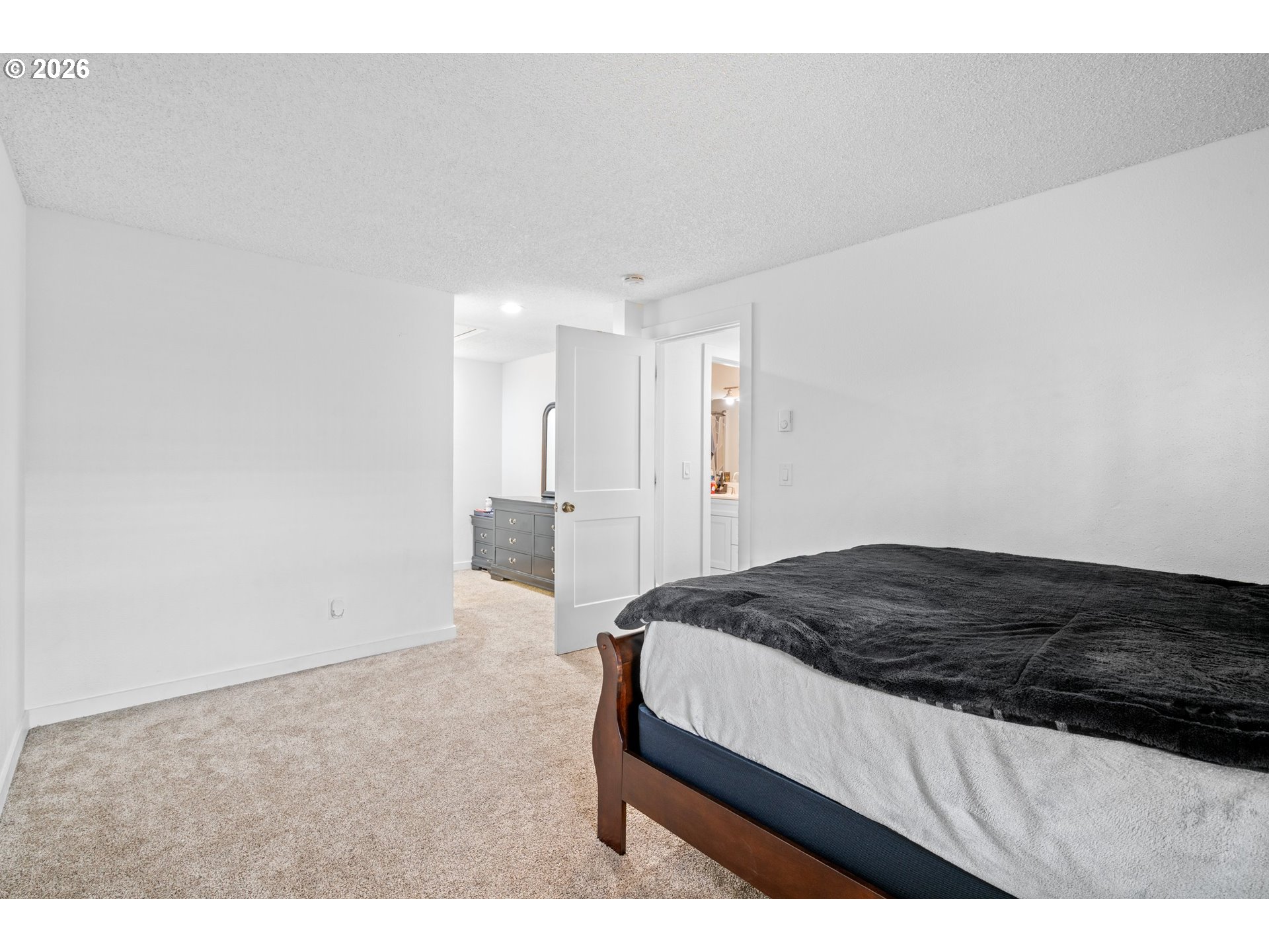 3311-3313 Northeast View Avenue Gresham, OR 97030 - Photo 15 of 26 a bedroom with a bed and a cabinets
