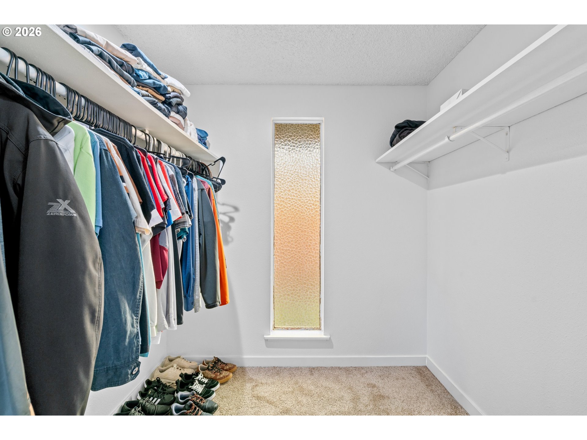 3311-3313 Northeast View Avenue Gresham, OR 97030 - Photo 16 of 26 a view of walk in closet with clothes