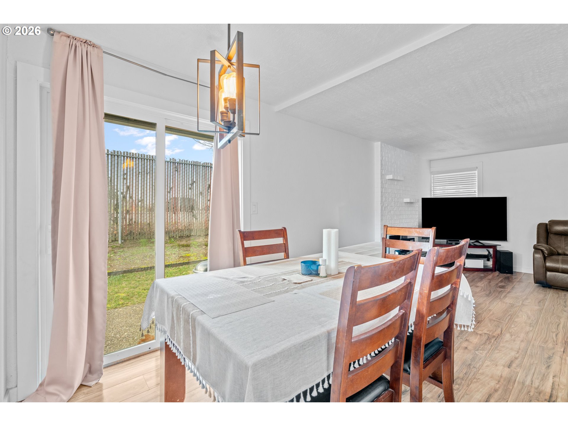 3311-3313 Northeast View Avenue Gresham, OR 97030 - Photo 18 of 26 a view of a livingroom with furniture and a flat screen tv