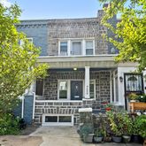 front view of a house with a garden