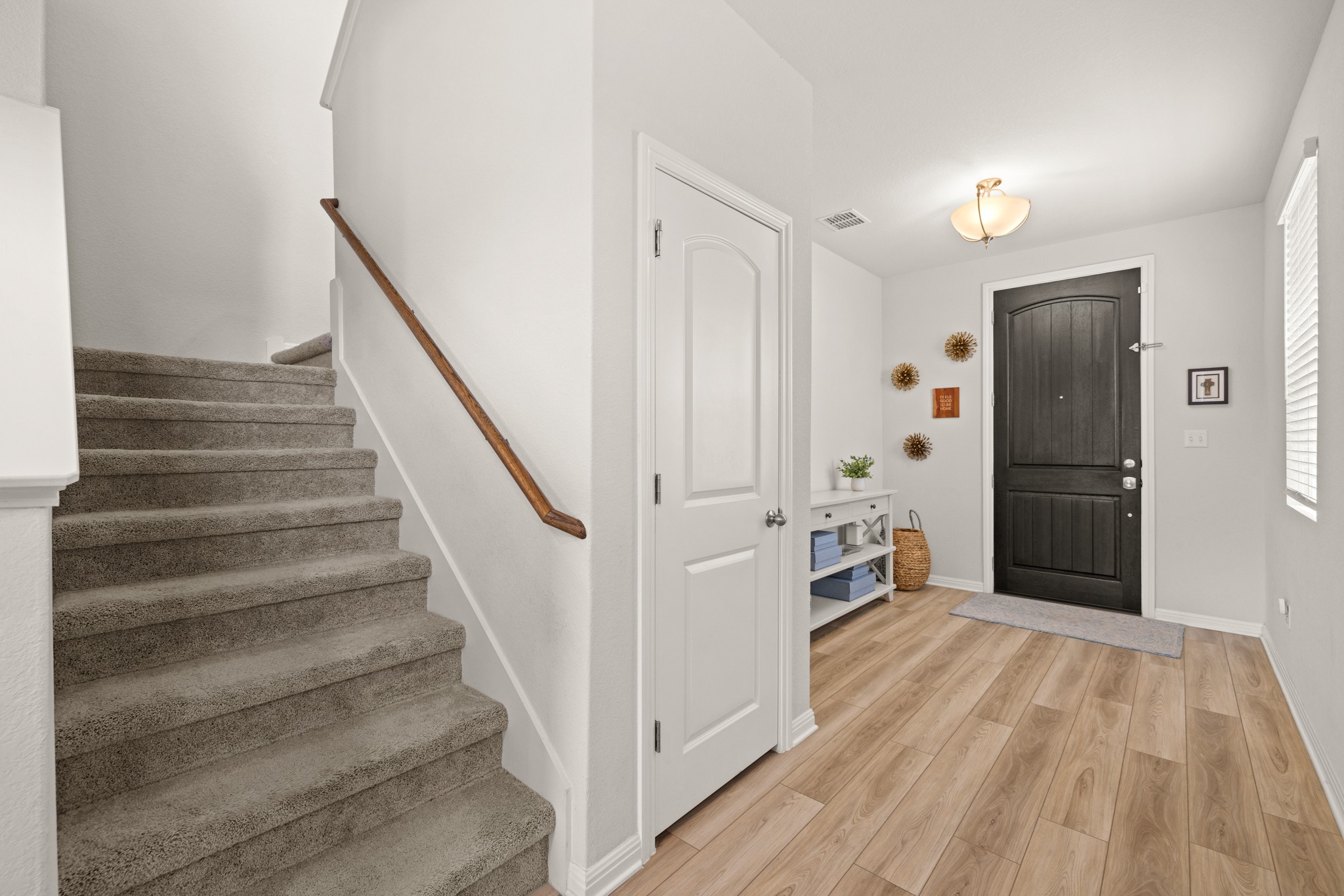 2049 Winston Way Leander, TX 78641 - Photo 11 of 35 The hall closet wraps underneath the stairs for abundant storage.