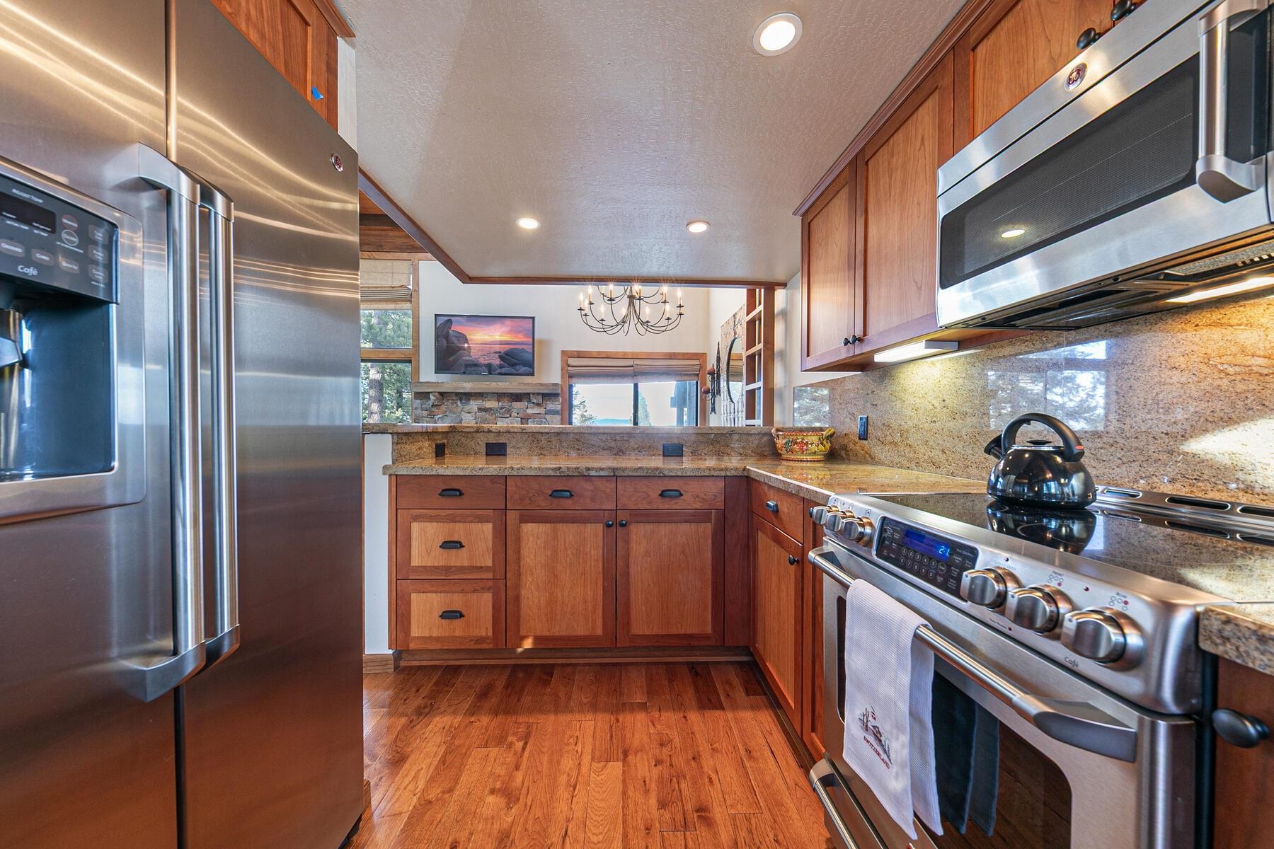 6108 Rocky Point Northstar, CA 96161 - Photo 10 of 28 a kitchen with stainless steel appliances granite countertop a stove and a refrigerator