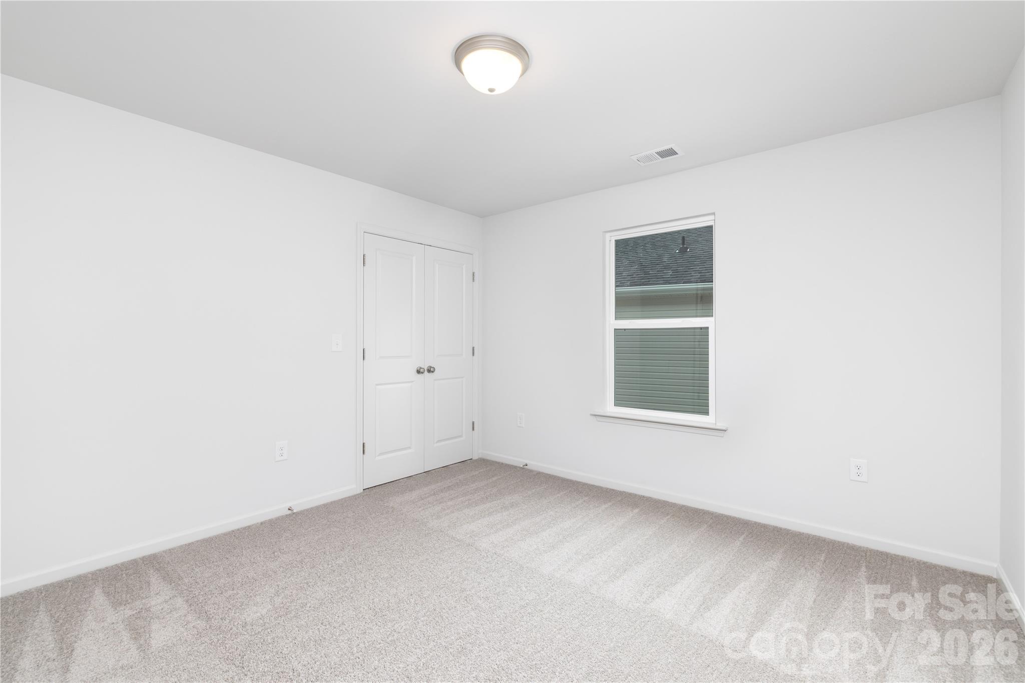 1418 Summerville Road Charlotte, NC 28214 - Photo 17 of 31 an empty room with a window