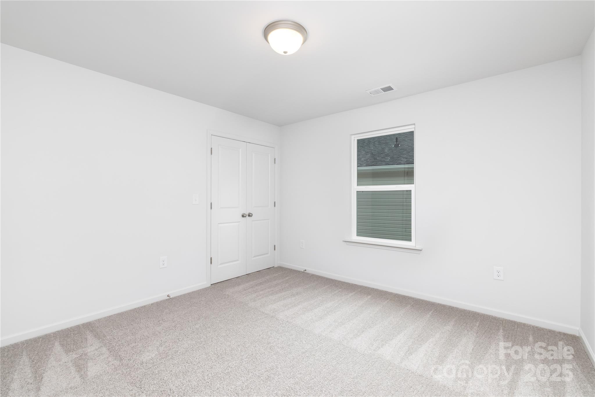 1418 Summerville Road Charlotte, NC 28214 - Photo 17 of 30 an empty room with a window