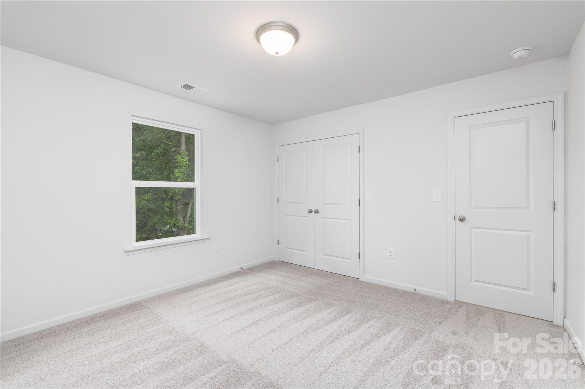 1418 Summerville Road Charlotte, NC 28214 - Photo 19 of 31 an empty room with windows