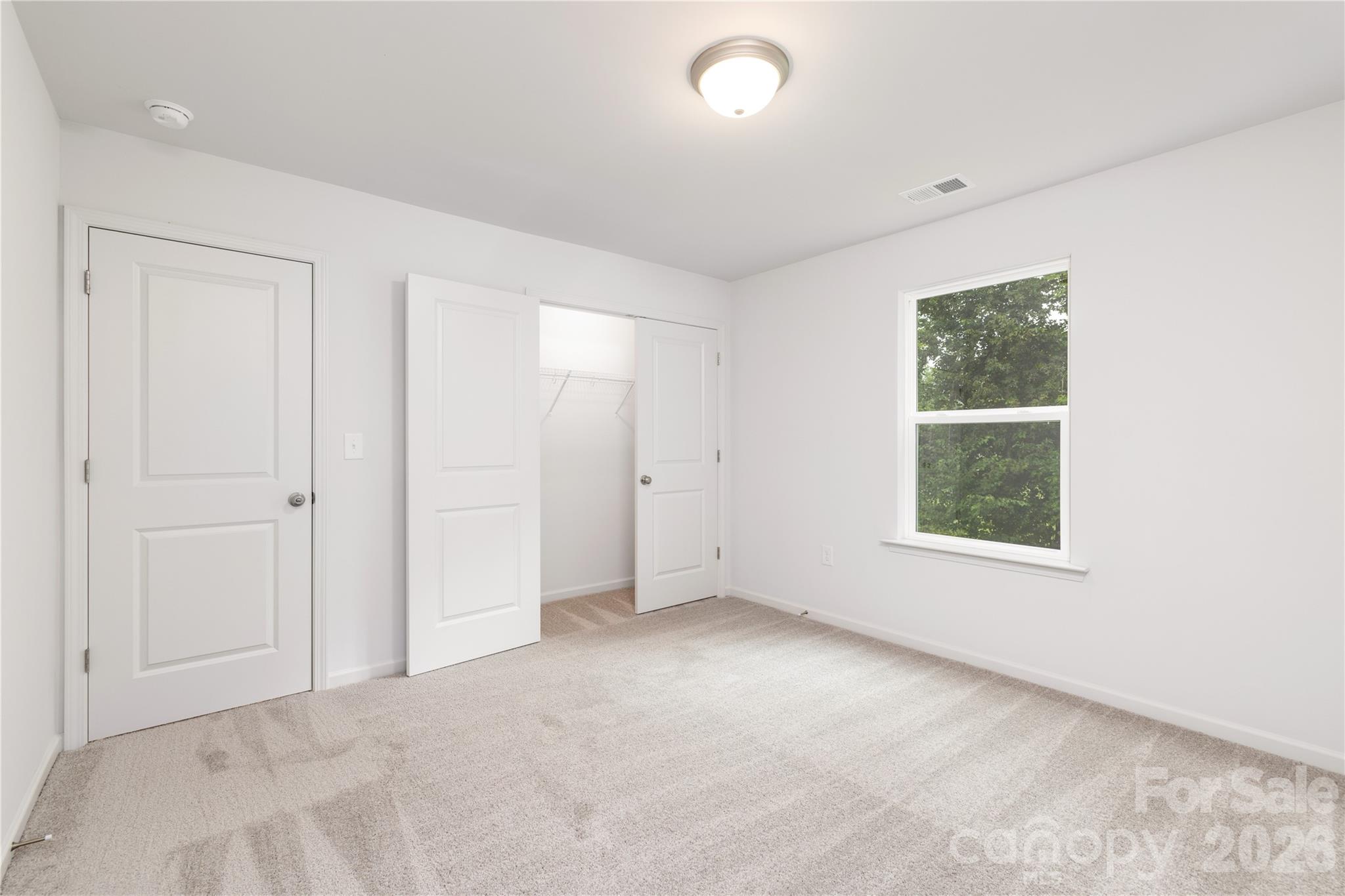 1418 Summerville Road Charlotte, NC 28214 - Photo 20 of 31 an empty room with windows