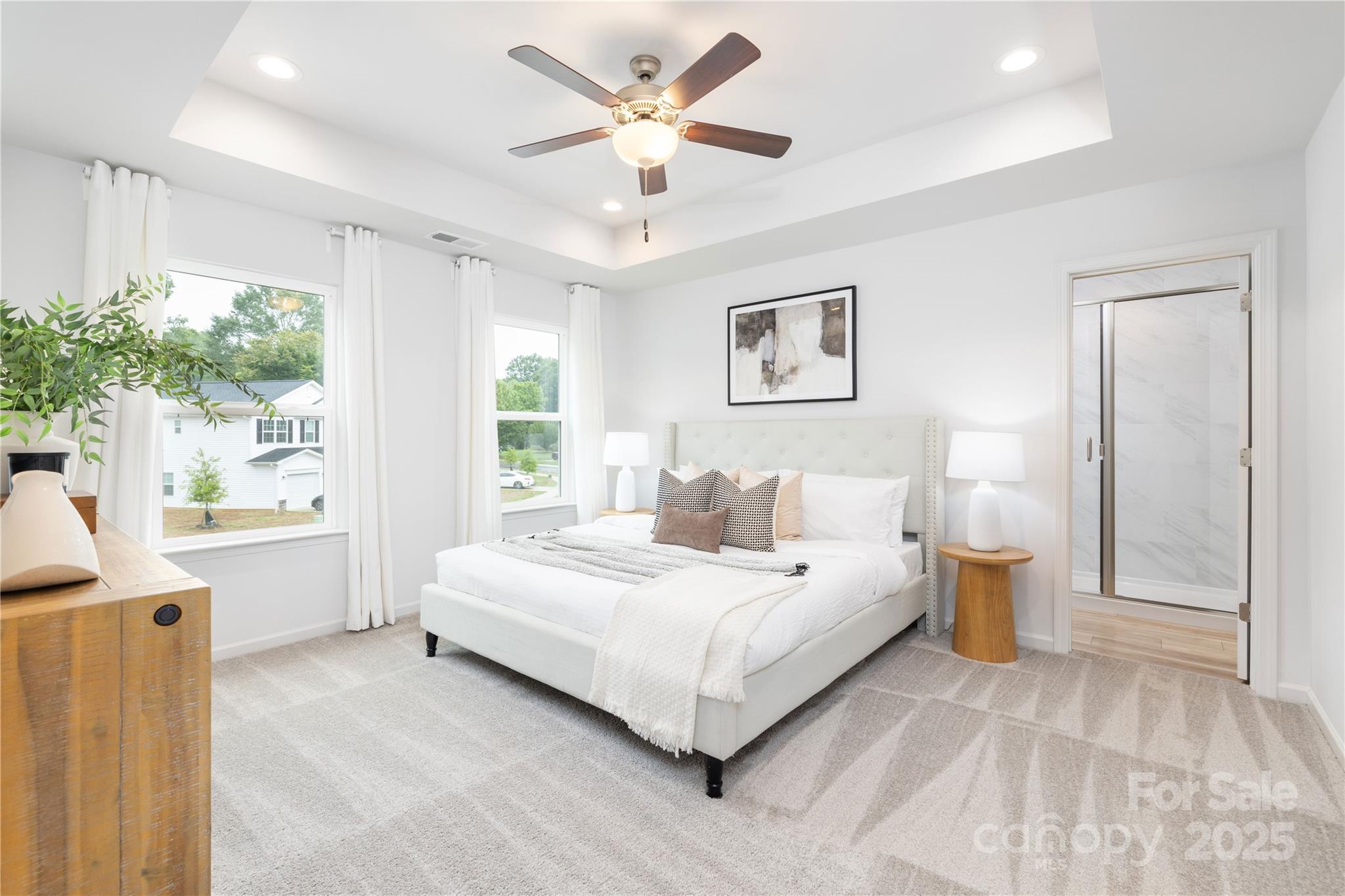 1418 Summerville Road Charlotte, NC 28214 - Photo 21 of 30 a bedroom with a large bed and a chandelier