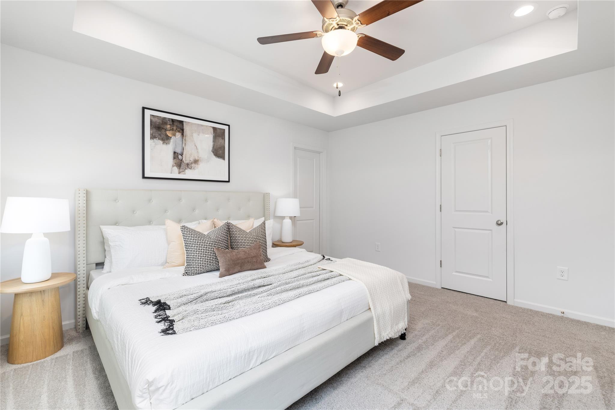 1418 Summerville Road Charlotte, NC 28214 - Photo 22 of 30 a bedroom with a large bed and a chandelier