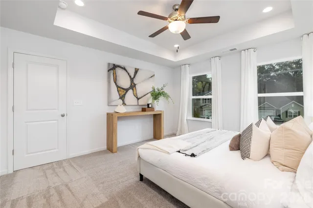 a bedroom with a large bed and a window